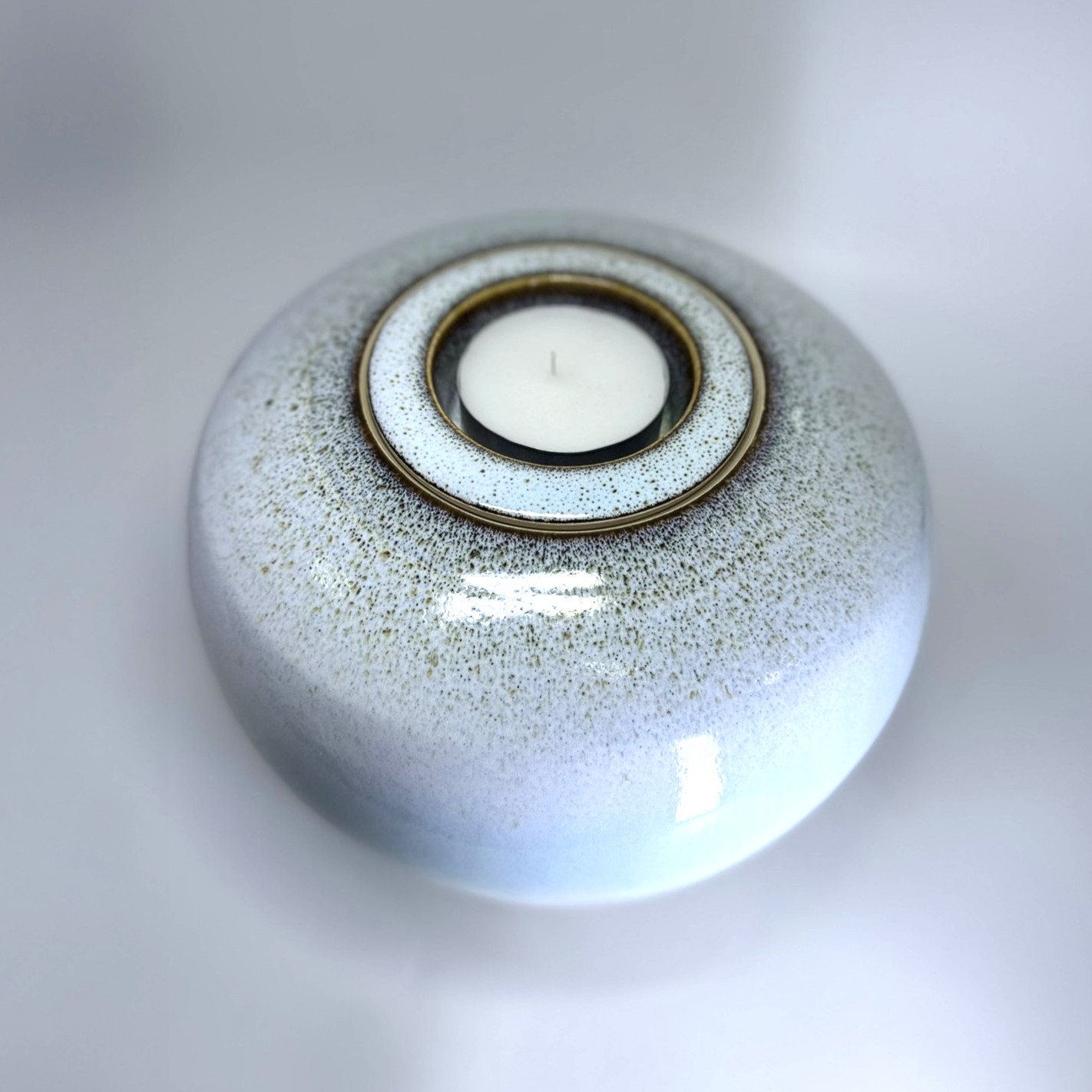 Aurora medium sized Cremation Urn 4 Aurora ceramic cremation urn with speckled pale blue glaze and tealight memorial candle holder