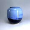 Blue Moon ceramic cremation urn with periwinkle blue glaze and black base accent