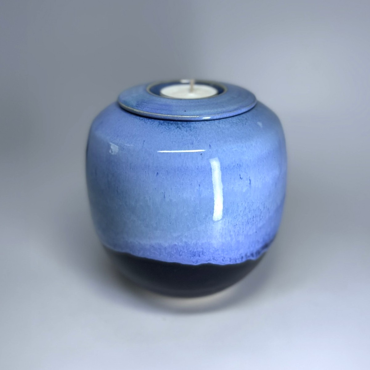 Handmade ceramic urn with tealight holder in moonlight blue glaze with dark base