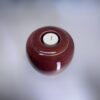 Ember 900ml cremation urn top view showing tealight candle holder and rich red glaze