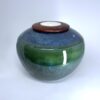 Medium ceramic memorial urn in deep green and navy blue ombre with glossy finish