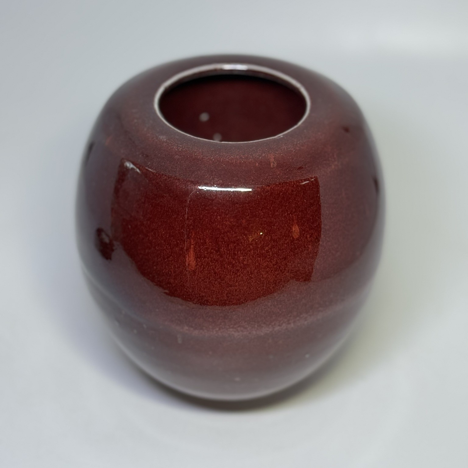 Flame 900ml cremation urn without lid showing rounded form and rich burgundy finish
