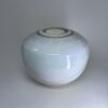Medium memorial urn in soft ivory showing smooth rounded form and subtle glaze texture