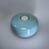 Medium ceramic memorial urn in pale turquoise blue with smooth glossy finish
