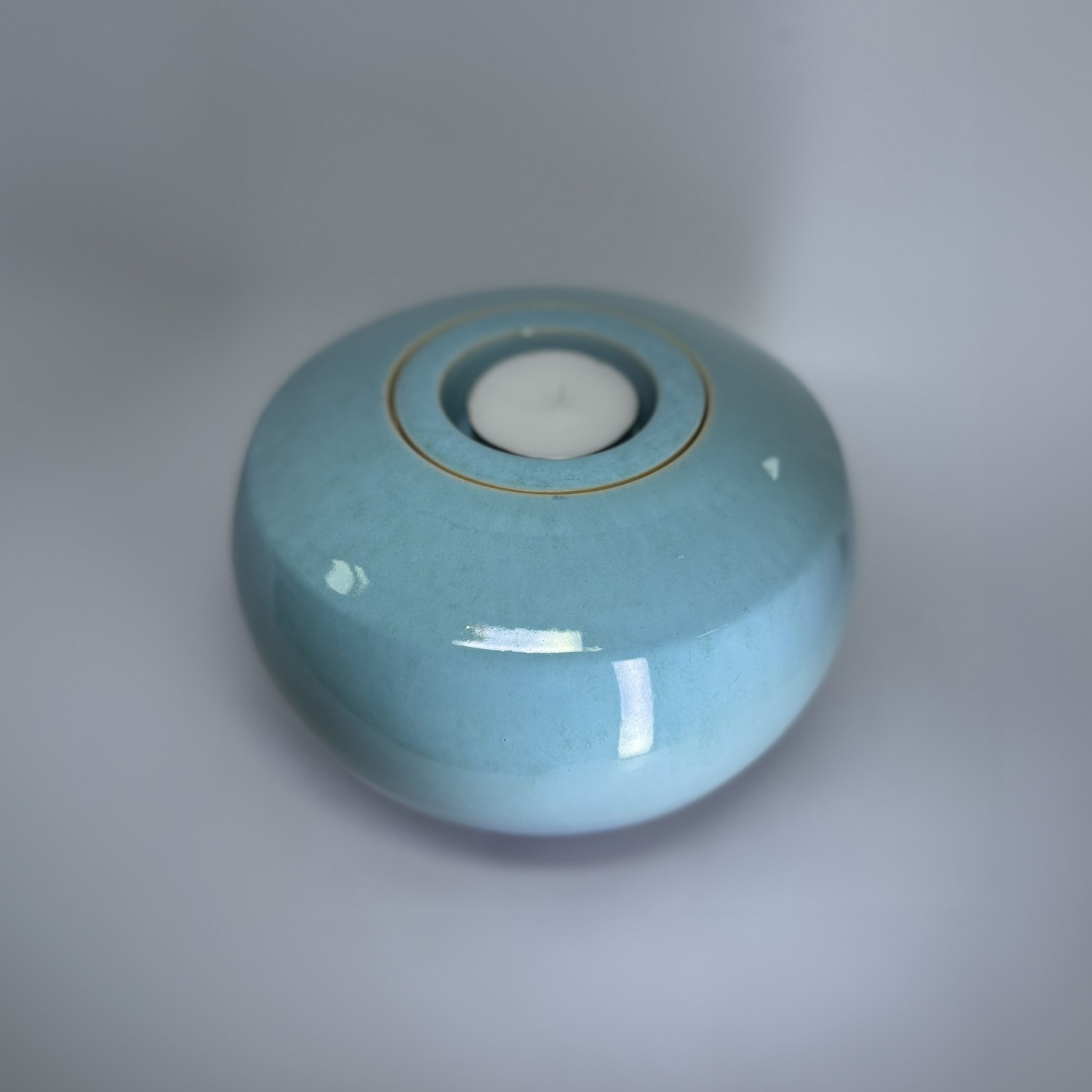 Medium ceramic memorial urn in pale turquoise blue with smooth glossy finish
