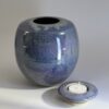 Handmade ceramic memorial urn with removable candle holder lid in purple rain glaze