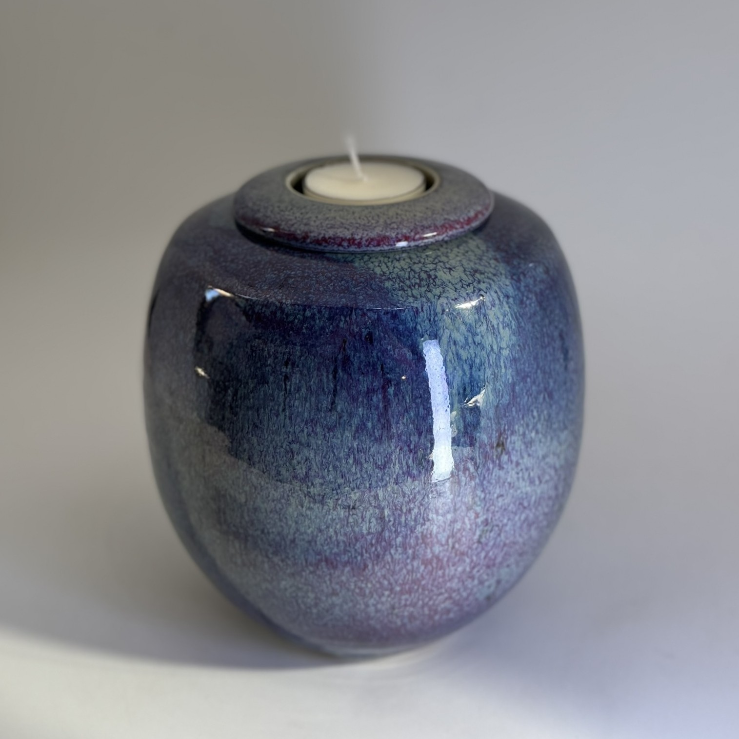 Purple Rain 900ml cremation urn with purple to pink ombre glaze and memorial candle