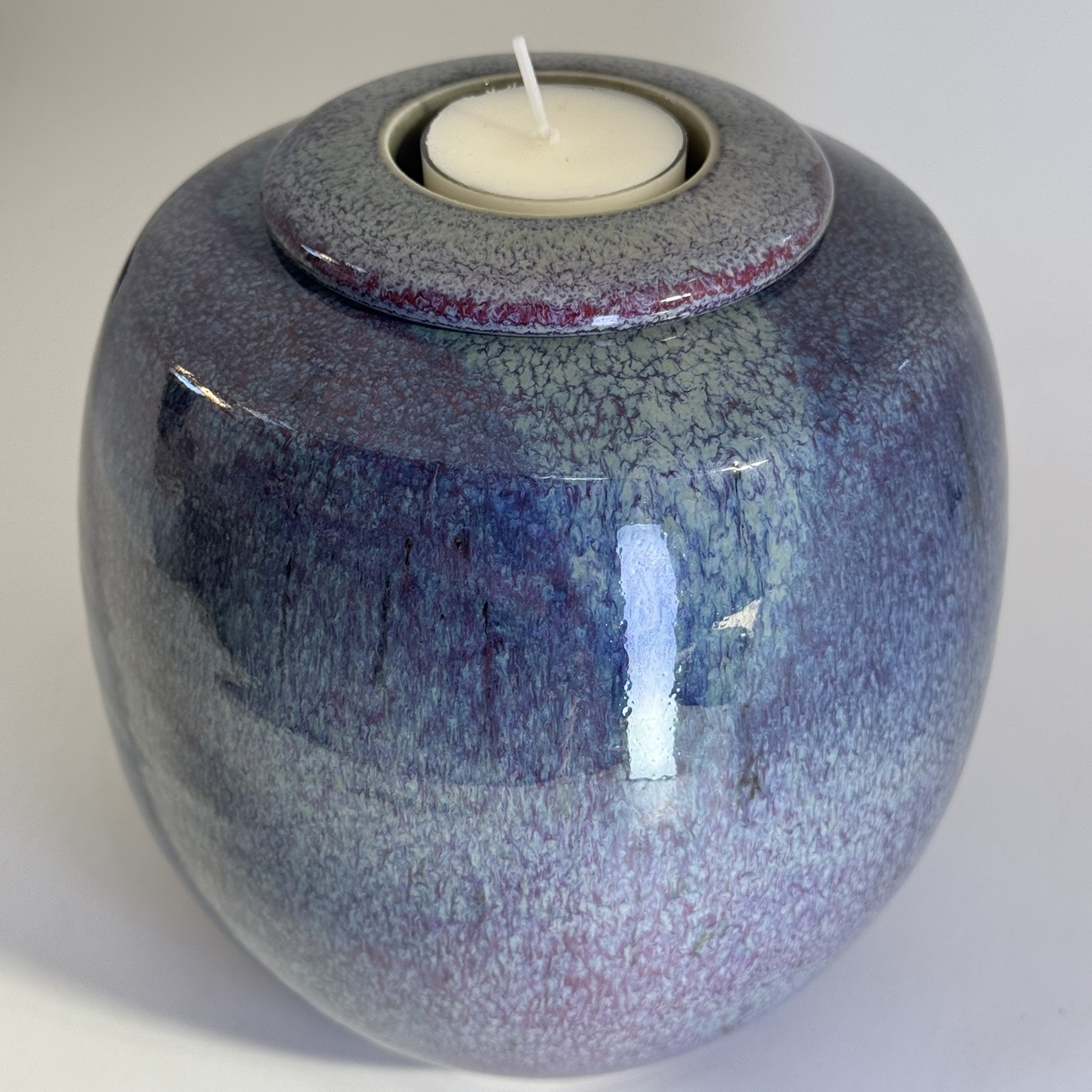 Purple Rain memorial urn close-up showing textured multi-toned purple and blue glaze detail