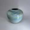 Seagem - Medium Cremation Urn 2500ml (4) Ceramic cremation vessel without lid showing turquoise wave glaze and rounded shape
