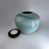 Seagem - Medium Cremation Urn 2500ml (5) Medium cremation urn with removable black lid shown separately displaying ocean-inspired glaze