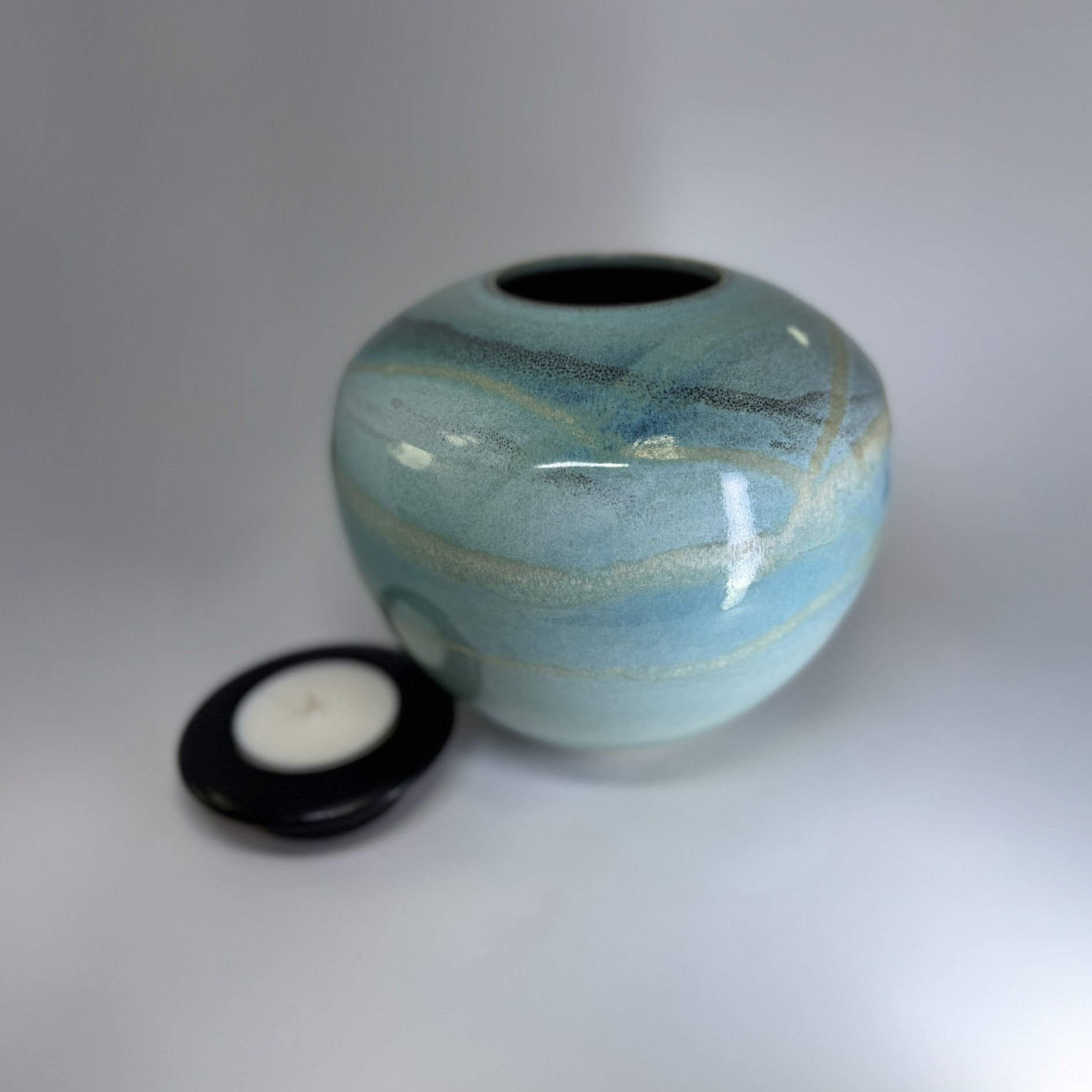 Seagem - Medium Cremation Urn 2500ml (5) Medium cremation urn with removable black lid shown separately displaying ocean-inspired glaze