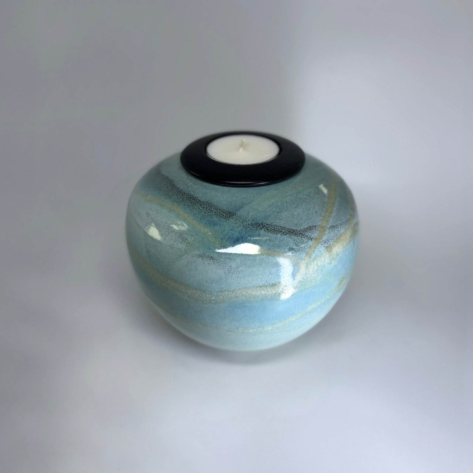 Seagem - Medium Cremation Urn 2500ml (6) Seagem memorial urn with tealight candle holder showing sea green and blue layered glaze
