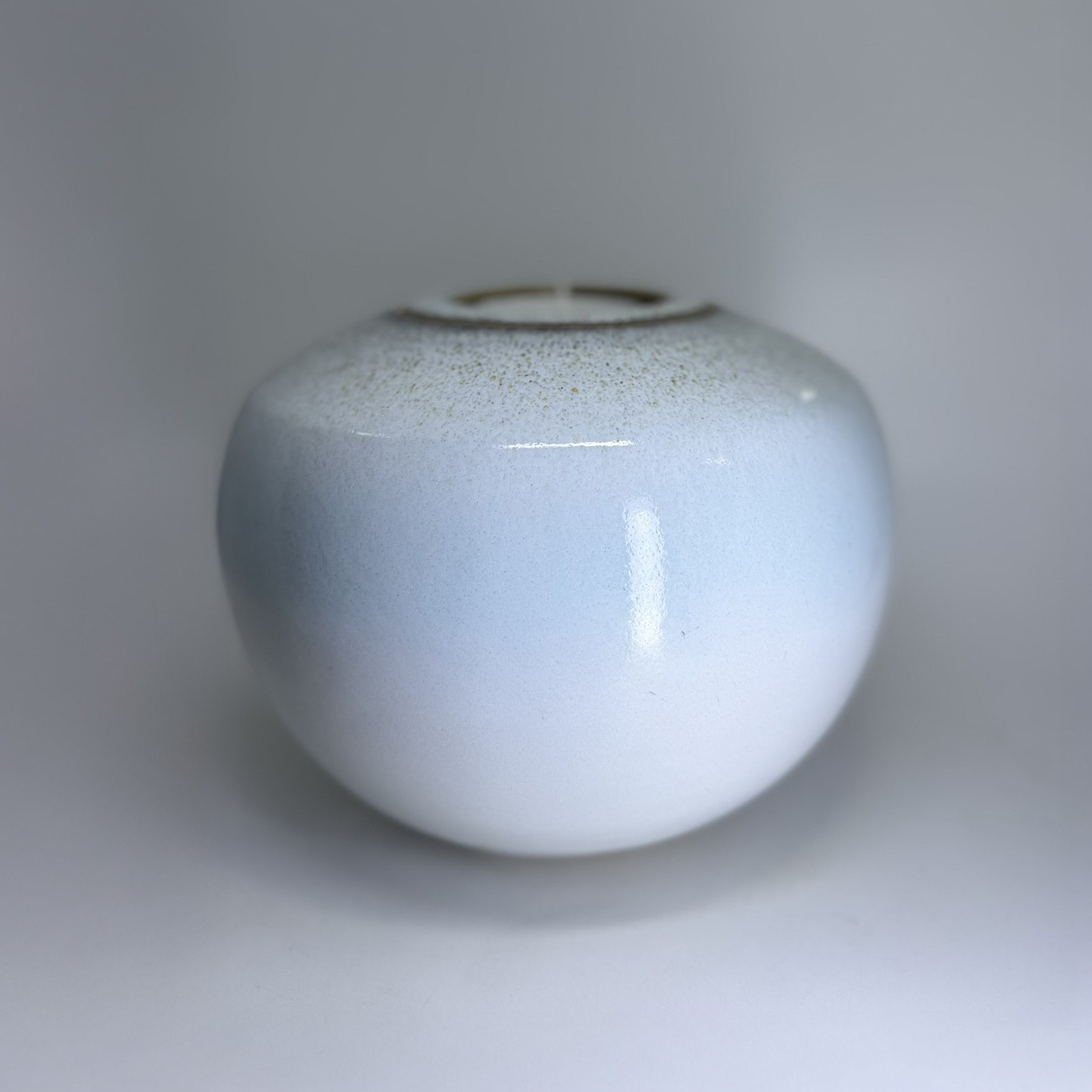 Aurora medium sized Cremation Urn 3 Handmade ceramic cremation urn in soft blue glaze with rounded vessel shape